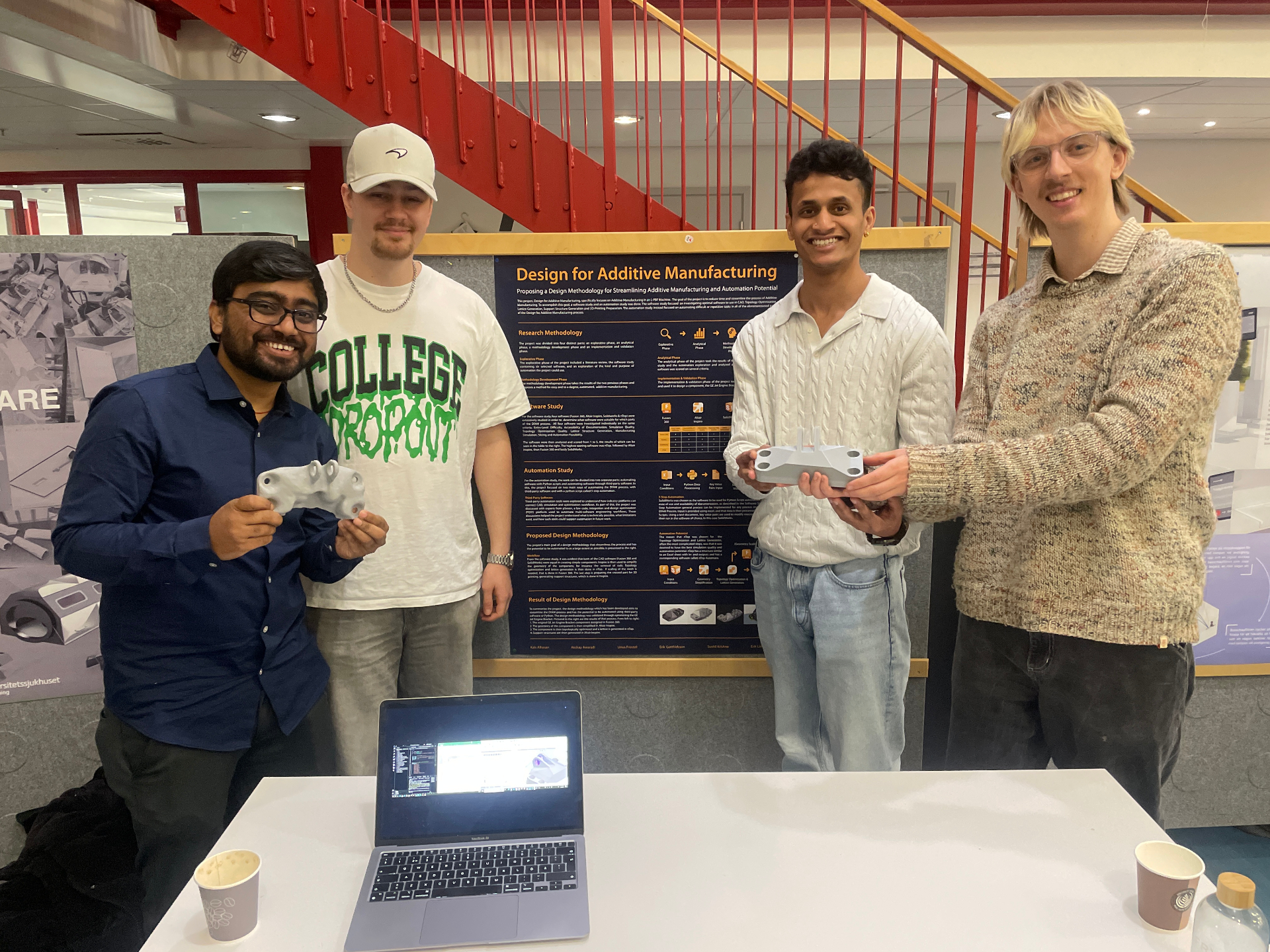 Placeholder text — the project team presenting the L-PBF design methodology poster at the end-of-course exhibition.